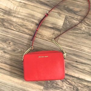 Michael Kors pocketbook.  Coral color